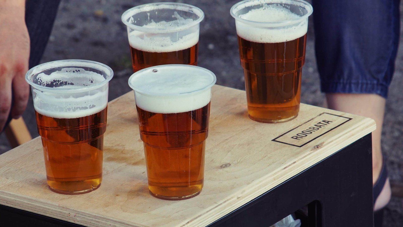Unveiling 8 Causes of Stubborn Belly Fat four beers on a tray
